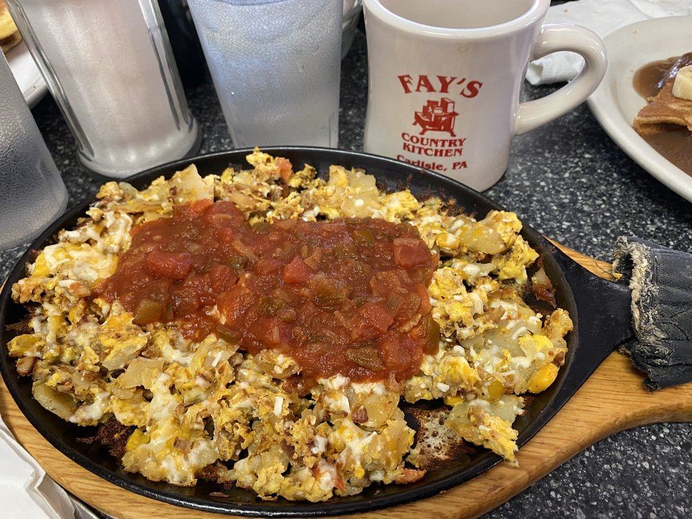 Fiesta skillet with salsa and melted cheese, and a Fay's mug